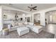 Open concept living room showcasing tile floors and seamless transition to the modern kitchen at 4747 S Aileron Ln, Mesa, AZ 85212