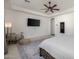 Spacious main bedroom with plush carpet, ceiling fan, and large window provides plenty of natural light at 4747 S Aileron Ln, Mesa, AZ 85212