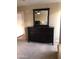 Well-lit bedroom with a dresser and large mirror at 4808 N 24Th St # 824, Phoenix, AZ 85016