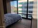 Main bedroom with large windows and city views at 4808 N 24Th St # 824, Phoenix, AZ 85016