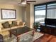 Spacious living room featuring hardwood floors and large windows at 4808 N 24Th St # 824, Phoenix, AZ 85016