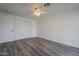 Bright bedroom with wood-look floors and double closets at 5039 N 18Th Ave, Phoenix, AZ 85015