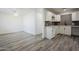 Modern kitchen featuring white shaker cabinets, gray tile backsplash, and quartz countertops at 5039 N 18Th Ave, Phoenix, AZ 85015