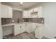 White laundry room cabinets with gray tile backsplash at 5039 N 18Th Ave, Phoenix, AZ 85015