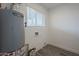 Laundry room with new flooring and water heater at 5039 N 18Th Ave, Phoenix, AZ 85015