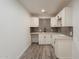 Clean wet bar with white cabinets and gray tile backsplash at 5039 N 18Th Ave, Phoenix, AZ 85015