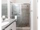 Clean bathroom with a walk-in shower and granite vanity at 5450 E Deer Valley Dr # 1004, Phoenix, AZ 85054