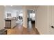 Hallway view of condo with kitchen and bedroom at 5450 E Deer Valley Dr # 1004, Phoenix, AZ 85054