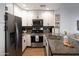 Modern condo kitchen with granite countertops and stainless steel appliances at 5450 E Deer Valley Dr # 1004, Phoenix, AZ 85054