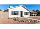 Newly renovated single story home with a rock garden and walkway at 6022 W Mauna Loa Ln, Glendale, AZ 85306