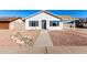 Newly renovated single story home with a rock garden and walkway at 6022 W Mauna Loa Ln, Glendale, AZ 85306