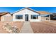 Newly renovated single story home with a rock garden and walkway at 6022 W Mauna Loa Ln, Glendale, AZ 85306