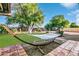 Relaxing backyard with hammock and grassy area at 6235 E Larkspur Dr, Scottsdale, AZ 85254