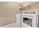 Laundry room with washer, dryer, and overhead shelving at 7143 W Golden Ln, Peoria, AZ 85345