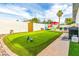 Backyard with putting green, pool, and entertaining area at 7416 E Holly St, Scottsdale, AZ 85257