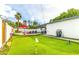 Large backyard with putting green, pool, and patio at 7416 E Holly St, Scottsdale, AZ 85257