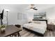 Main bedroom with a king-size bed, and built in workspace at 7416 E Holly St, Scottsdale, AZ 85257