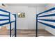 Bedroom featuring two bunk beds and a wall-mounted TV at 7416 E Holly St, Scottsdale, AZ 85257