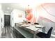Contemporary dining area featuring a grey table and black velvet chairs at 7416 E Holly St, Scottsdale, AZ 85257