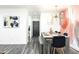 Modern dining room with a large table and statement wall art at 7416 E Holly St, Scottsdale, AZ 85257