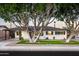 Charming single story home with a manicured lawn and mature trees at 7416 E Holly St, Scottsdale, AZ 85257