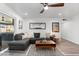 Spacious living room featuring a comfortable sectional sofa and access to the patio at 7416 E Holly St, Scottsdale, AZ 85257