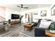 Open living space with a grey sectional sofa and a modern coffee table at 7416 E Holly St, Scottsdale, AZ 85257