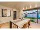Covered patio with dining area and view of backyard at 7416 E Holly St, Scottsdale, AZ 85257
