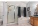 Bathroom with large soaking tub, shower, and granite vanity at 7421 W Villa Hermosa Ave, Glendale, AZ 85310