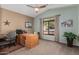 Bright home office featuring a large desk and window at 7421 W Villa Hermosa Ave, Glendale, AZ 85310