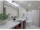 Modern bathroom with a marble vanity, bathtub, and shower at 750 E Northern Ave # 1053, Phoenix, AZ 85020
