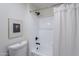 Clean bathroom with a shower/tub combo and white tile at 750 E Northern Ave # 1053, Phoenix, AZ 85020