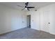 Bright bedroom with two doors and ceiling fan at 750 E Northern Ave # 1053, Phoenix, AZ 85020