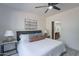 Main bedroom with ceiling fan and access to bathroom at 750 E Northern Ave # 1053, Phoenix, AZ 85020