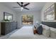Bright bedroom with a king-size bed, dresser, and large window at 750 E Northern Ave # 1053, Phoenix, AZ 85020