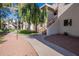 Paved pathway winds through a grassy courtyard with trees and lamp posts at 750 E Northern Ave # 1053, Phoenix, AZ 85020