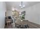 Dining area with a round wooden table and metal chairs near living room at 750 E Northern Ave # 1053, Phoenix, AZ 85020