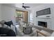 Living area with a grey sofa, coffee table, and fireplace at 750 E Northern Ave # 1053, Phoenix, AZ 85020