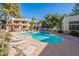 Community pool with lounge chairs and a spa at 750 E Northern Ave # 1053, Phoenix, AZ 85020