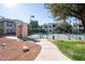 Community tennis court with surrounding landscape at 750 E Northern Ave # 1053, Phoenix, AZ 85020