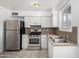 Efficient kitchen with stainless steel appliances and white cabinets at 7749 W Orange Dr, Glendale, AZ 85303