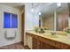 Bathroom with double vanity and floral decor at 816 S Esperanza Ave, Mesa, AZ 85208