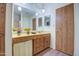 Clean bathroom with double vanity and wood cabinets at 816 S Esperanza Ave, Mesa, AZ 85208