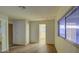 Simple bedroom with wood floors and access to another room at 816 S Esperanza Ave, Mesa, AZ 85208