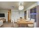 Dining room with wood table, four chairs, and a chandelier at 816 S Esperanza Ave, Mesa, AZ 85208