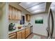 Kitchen with wood cabinets, granite counters, and stainless steel appliances at 816 S Esperanza Ave, Mesa, AZ 85208