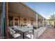 Covered patio with dining table and seating area at 816 S Esperanza Ave, Mesa, AZ 85208