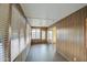 Sunroom with wood paneling and sliding glass doors at 816 S Esperanza Ave, Mesa, AZ 85208