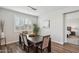 Elegant dining room with dark wood table and seating for four at 8823 N 186Th Ave, Waddell, AZ 85355