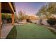 Backyard with putting green, hot tub, and mountain views at 9887 E Edgestone Dr, Scottsdale, AZ 85255